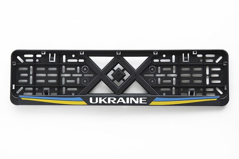 Рамка номерного знаку пластикова чорна Ukraine (шовкотрафарет, защіпка знизу) 12 Atelie Рамка номерного знака пластиковая черная Ukraine (шелкотрафарет, защёлка снизу) 12 Atelie